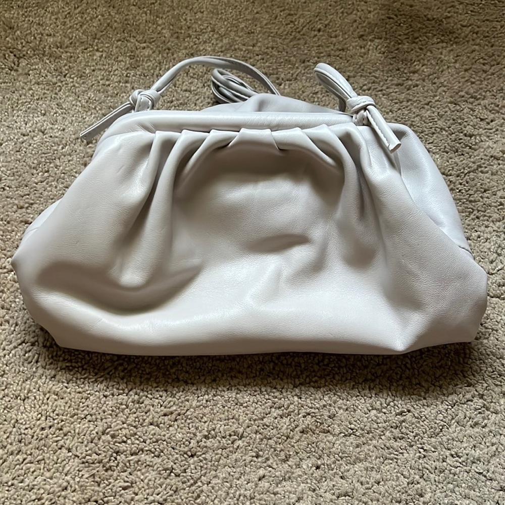 Pewter cross body with detachable strap, never used.